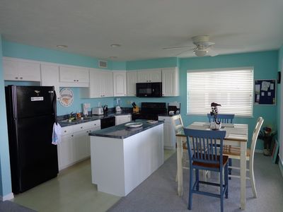 Kitchen/Dining area overlooking the Gulf. All Frigidaire appliances.